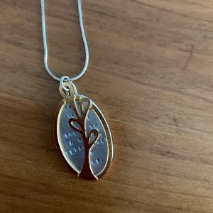 Sterling silver and 22 karat gold pendant necklace. Gold tree, silver medallion.